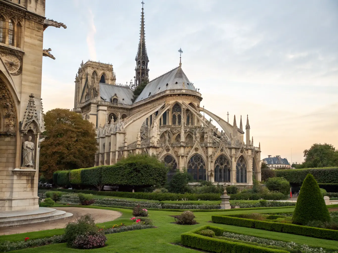 A detailed photograph showcasing the restored facade of the Saint-Theodore church, highlighting the intricate stonework and architectural details.